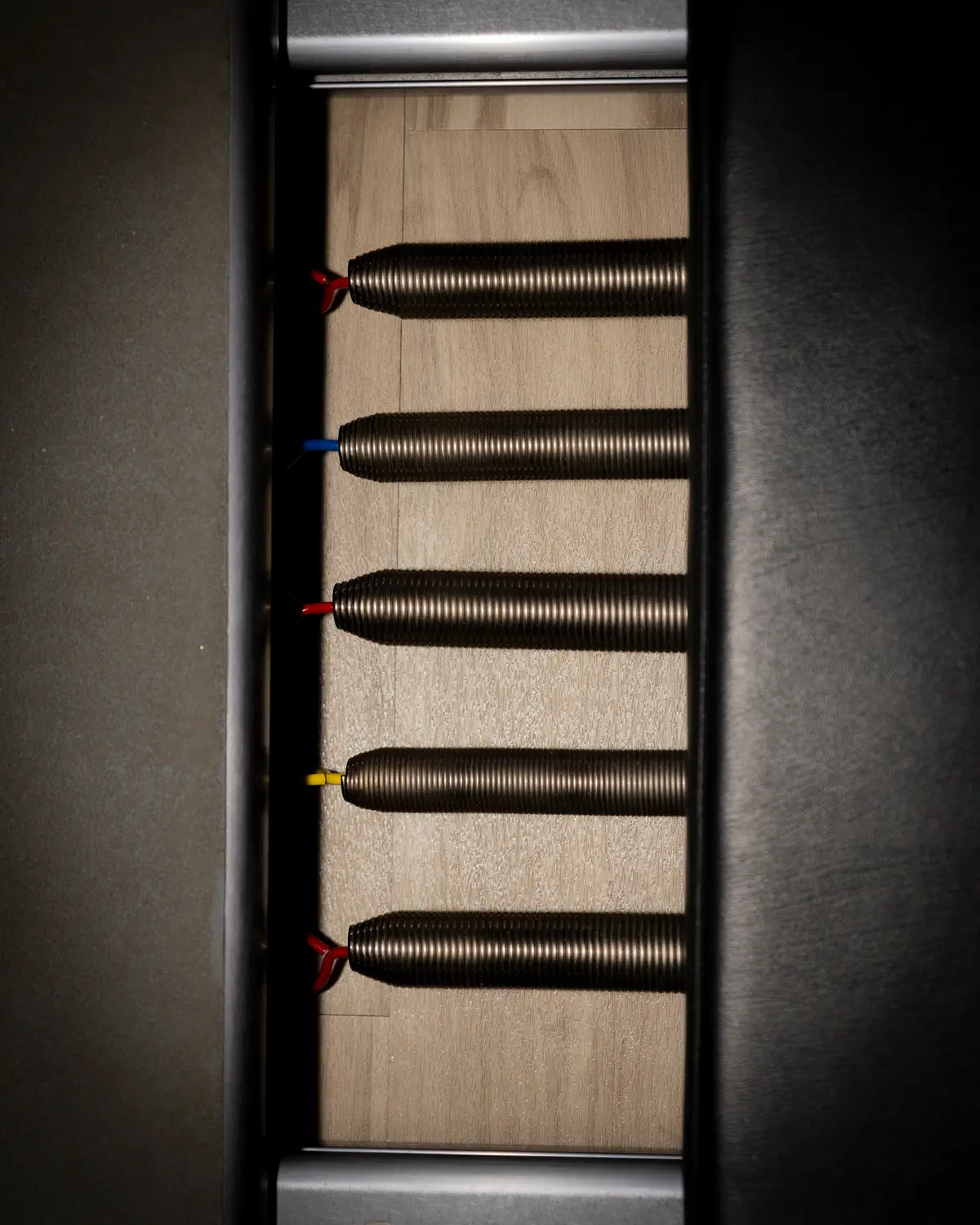 Close-up of colored springs on a Pilates reformer at HS Align